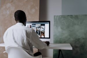 Man reviewing images on a computer