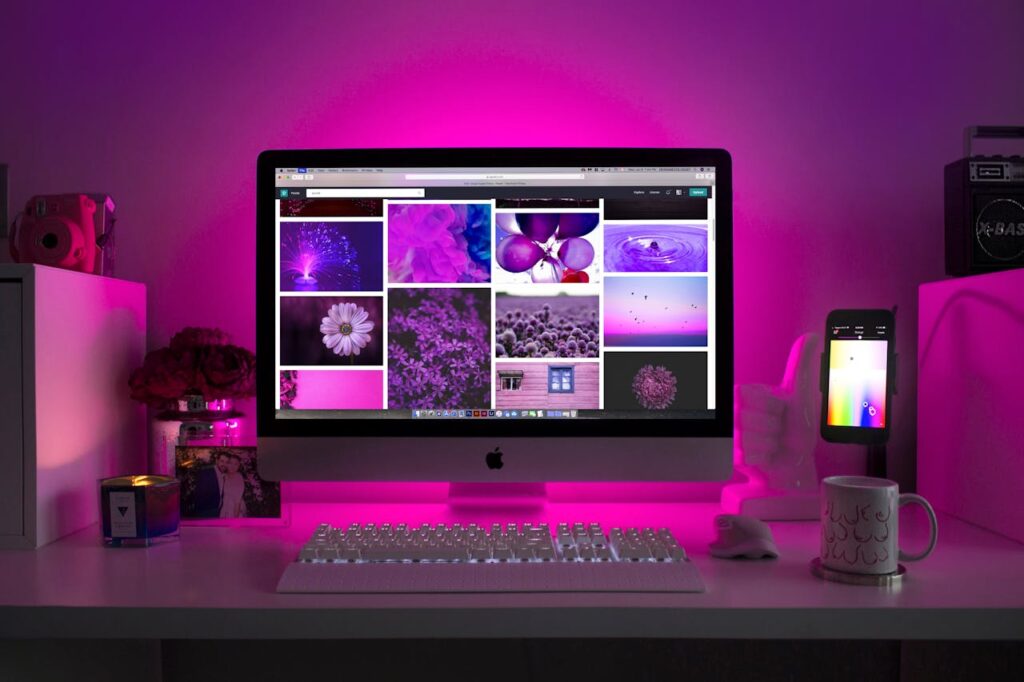 iMac computer with various images with a purple overlay