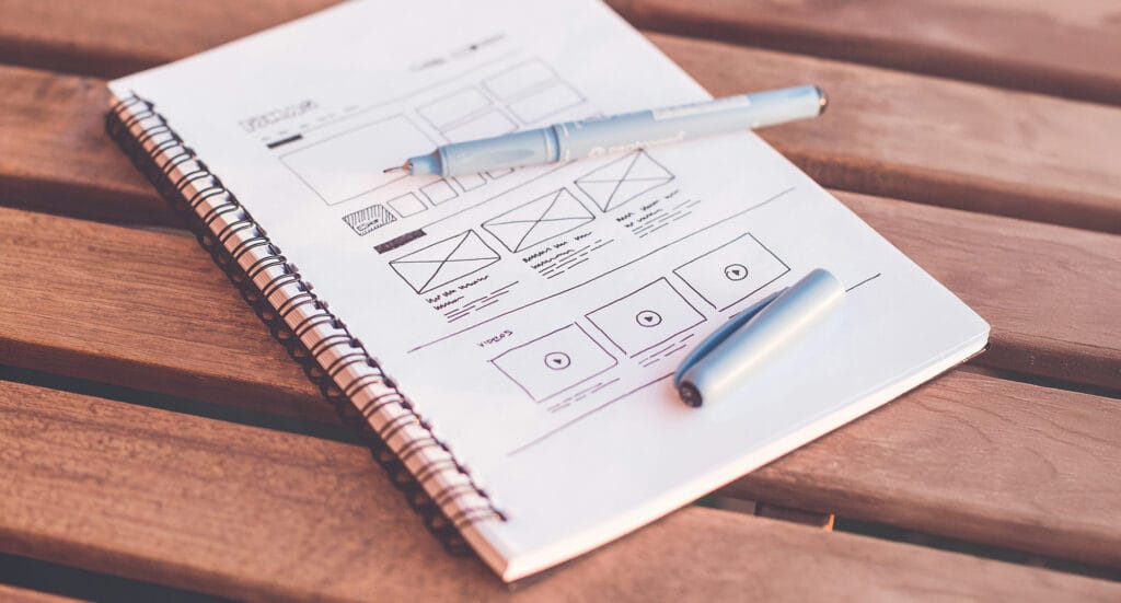 note book with UX sketch for landing pages